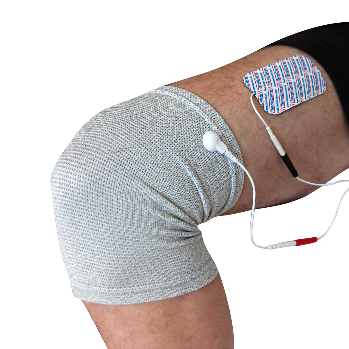 TensCare kneestim sleeve worn on a knee with an electrode pad and lead wires attached