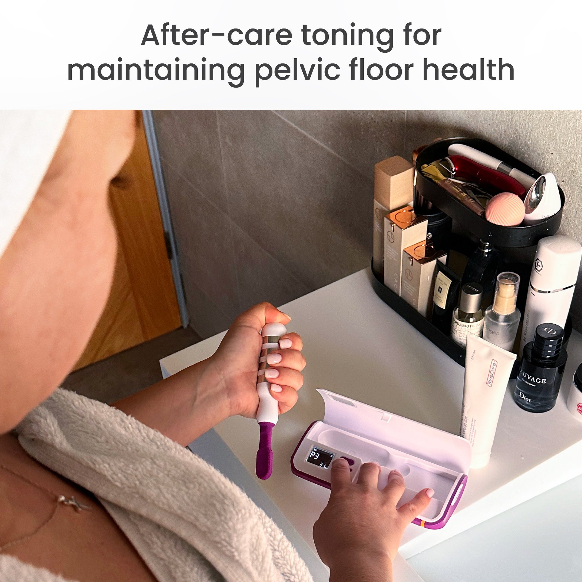 Woman using the iTouch Go exerciser at a bathroom counter, for after-care pelvic floor toning