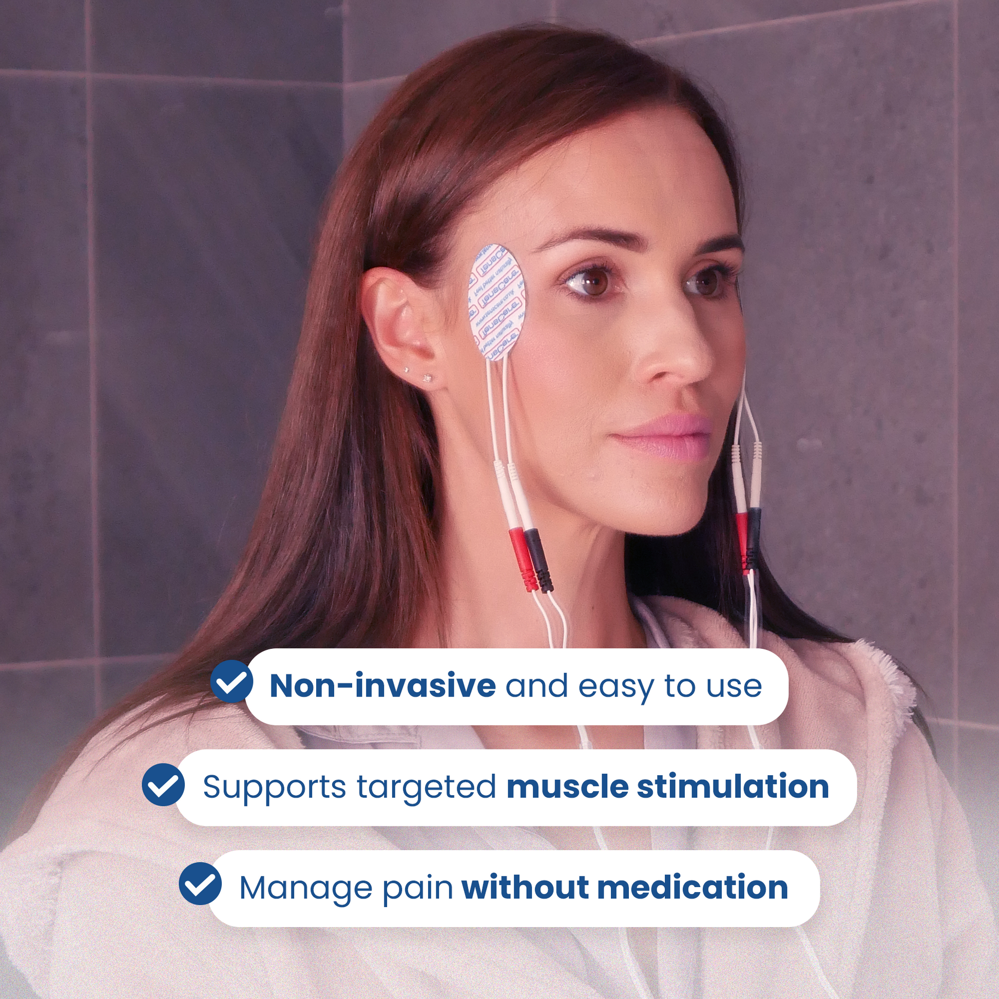 Woman wearing two face electrode pads for non-invasive targeted muscle stimulation