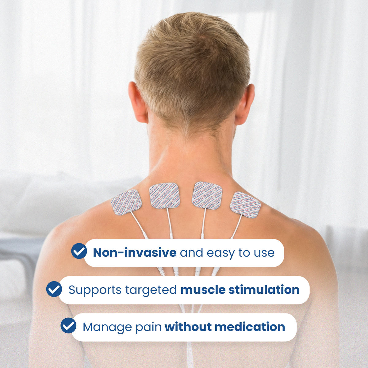 Man wearing four electrode pads across his upper back for non-invasive muscle stimulation