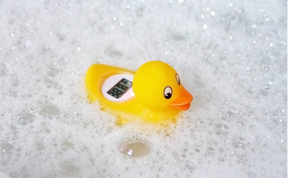 Digi Duckling thermometer floating in a bubble bath showing the water temperature