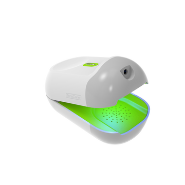 TensCare Nailit device open, showing its green treatment light, on a black background
