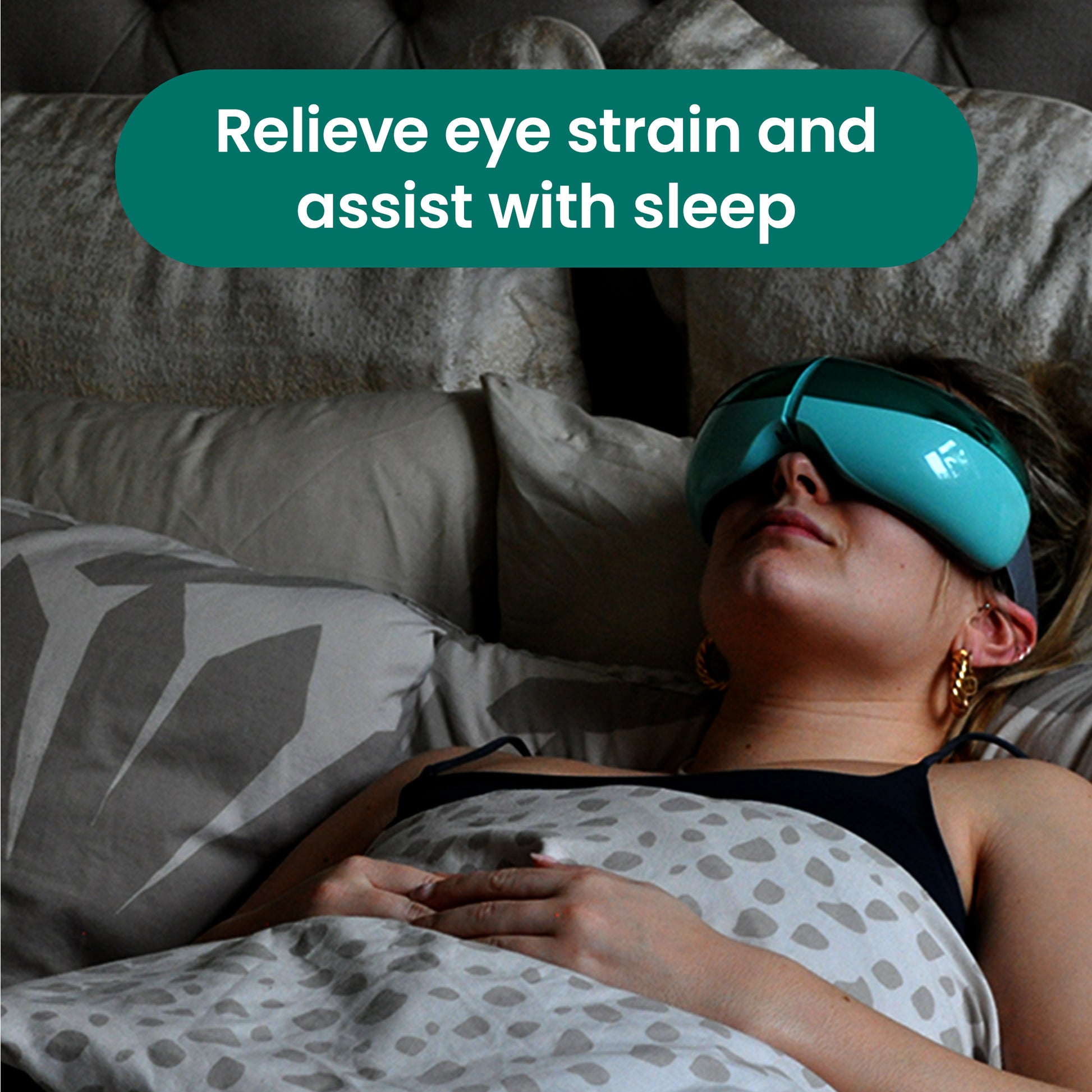 Woman lying down wearing the OKO eye massager, to relieve eye strain and assist with sleep