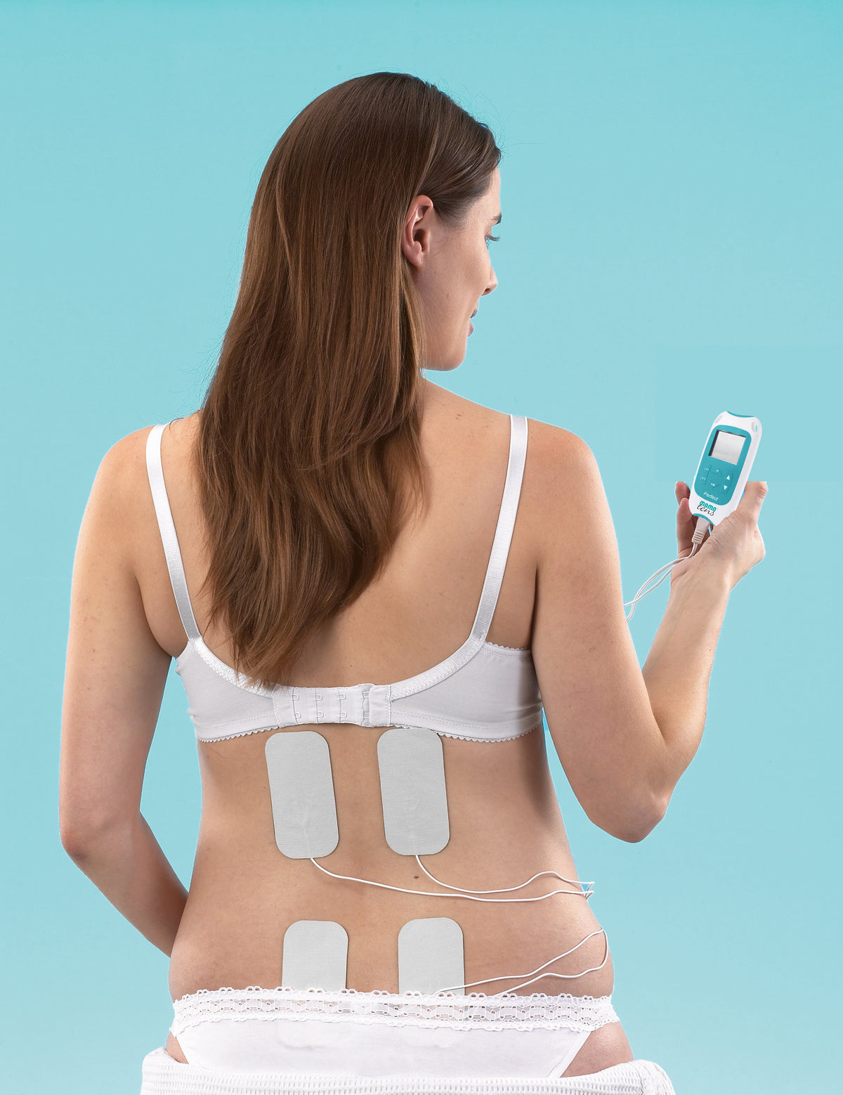 Woman wearing MamaTENS electrode pads on her back while holding the unit