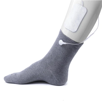 TensCare iSock conductive sock electrode worn on a foot with an electrode pad on the calf