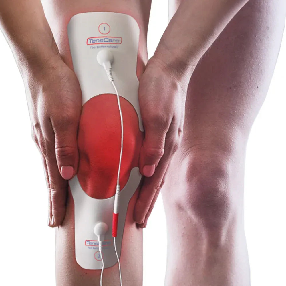 TensCare knee pain electrode pad wrapped around a knee, pain area highlighted in red