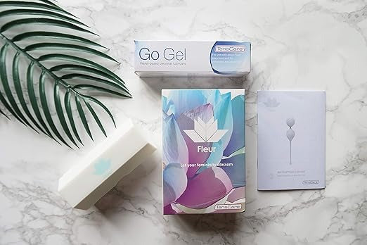 TensCare Fleur retail box with Go Gel lubricant and instruction booklet on a marble surface