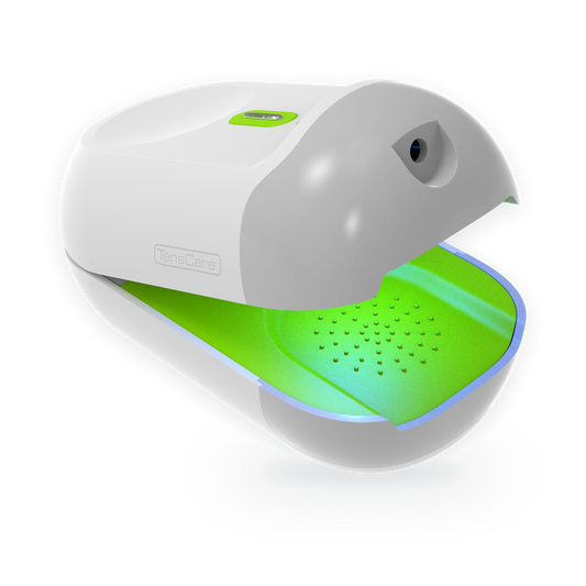 TensCare Nailit device open, showing its green treatment light